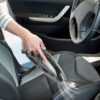 Gear shift and control buttons of a black car